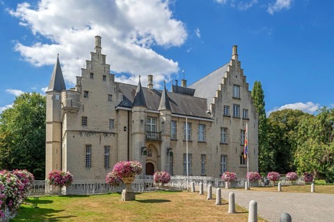 Kasteel Cortewalle, 15th century moated castle in Flemish Renaissance style at Beveren in summer,