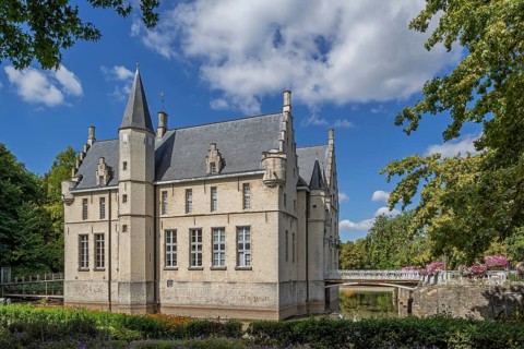 Kasteel Cortewalle, 15th century moated castle in Flemish Renaissance style at Beveren in summer,