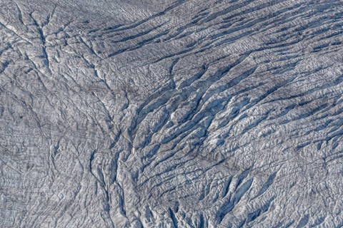 This view shows the ice surface with many crevasses. Distinct details reveal the effects of time