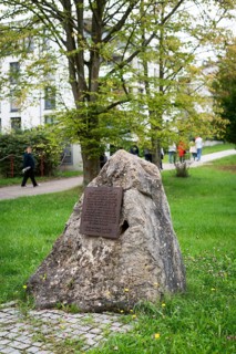 Stone with memorial plaque commemorating forced labourers and prisoners in concentration camp