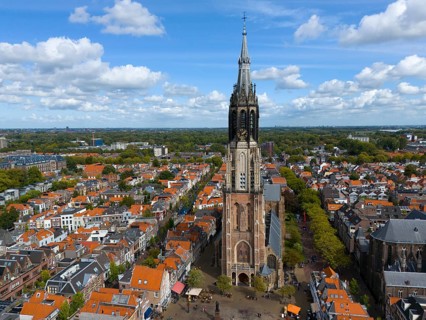 Central view of the historic city centre with high church tower and many red roofs, aerial view,