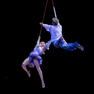 Two artists hover above the audience at the press screening of Alizé, a joint production by Cirque