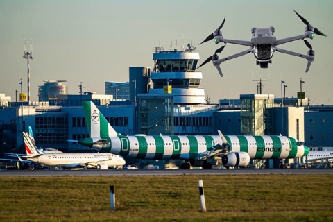 Symbolic image, photomontage, reconnaissance, spying with drones here at an airport, critical