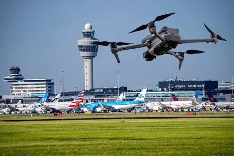 Symbolic image, photomontage, reconnaissance, spying with drones here at an airport, critical