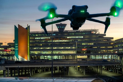 Symbolic image, photomontage, reconnaissance, spying with drones here at an airport, critical