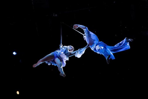 Two artists hover above the audience at the press screening of Alizé, a joint production by Cirque