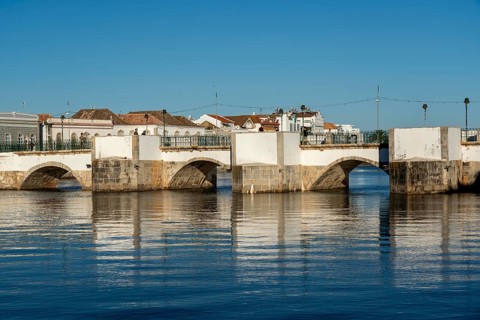 The seven-arched bridge over the Rio Gilão, in Tavira, old town, in the east of the Algarve,