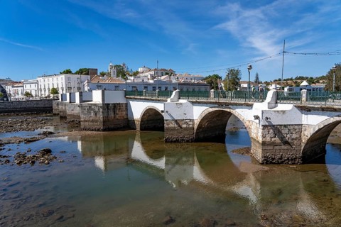 The seven-arched bridge over the Rio Gilão, in Tavira, old town, in the east of the Algarve,