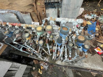 Infrastructure, water pipes and water meters of various houses, San Carlos, Negros Occidental,