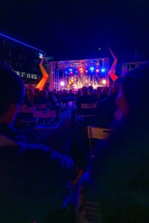 A night-time open-air concert with bright lights and a lively atmosphere, Sindelfingen, Böblingen