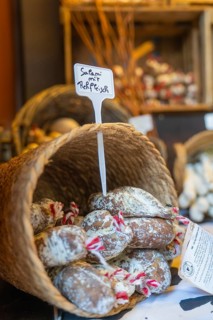 Basket of salami at a market stall with rustic products, Sindelfingen, Böblingen district, Germany