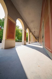 Historic arcades with symmetrical columns and shadow play, Munich, Germany