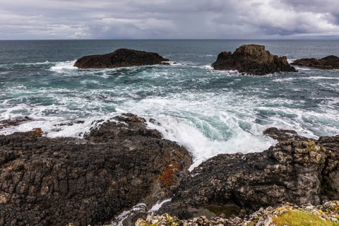 Rocky coast, offshore islands, Ballintoy Harbour, Causeway Coastal Route, Antrim, Northern Ireland,