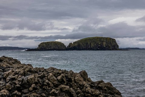 Rocky coast, offshore islands, Ballintoy Harbour, Causeway Coastal Route, Antrim, Northern Ireland,