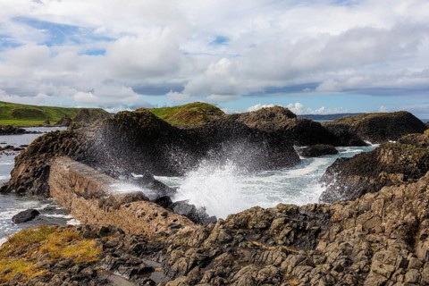 Breakwater at the fishing harbour, Ballintoy Harbour, Causeway Coastal Route, Antrim, Northern