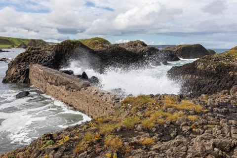Breakwater at the fishing harbour, Ballintoy Harbour, Causeway Coastal Route, Antrim, Northern
