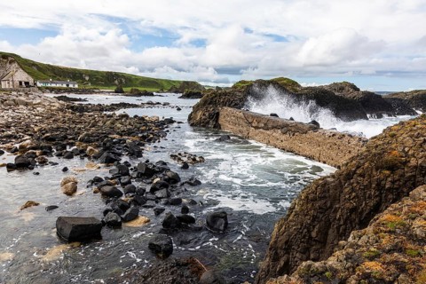 Breakwater at the fishing harbour, Ballintoy Harbour, Causeway Coastal Route, Antrim, Northern