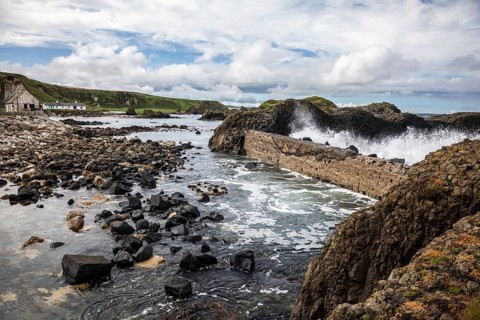 Breakwater at the fishing harbour, Ballintoy Harbour, Causeway Coastal Route, Antrim, Northern