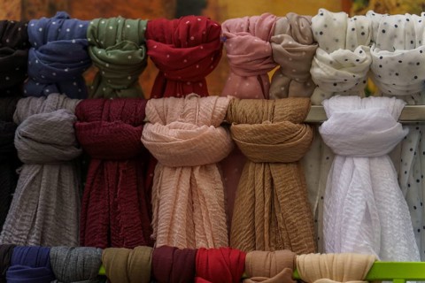 Warm and stylish scarves hanging, perfect for adding a touch of color and comfort to any outfit in