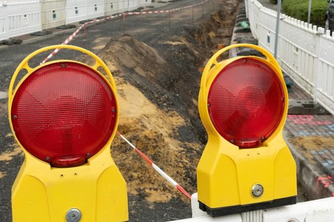 Borken, NRW, Germany, Red warning lights marking a construction site, ensuring safety with barrier