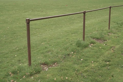 Borken, NRW, Germany, Metal railing boundary defining a sports field or park area
