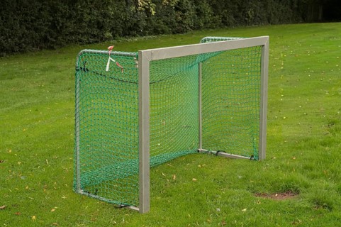 Borken, NRW, Germany, Soccer goal with green net standing on a grassy sports field