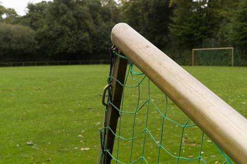 Borken, NRW, Germany, Soccer goal with green net on an empty grass field