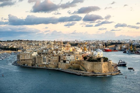 Beautiful sunset view of Valletta with Saint Angelo Fortress, capital city of Malta