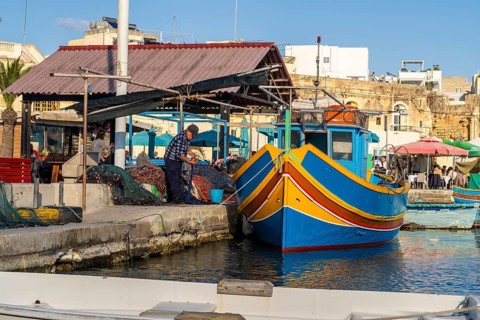 Beautiful view of Marsaxlokk, traditional maltese fisherman village on south of the island, Malta