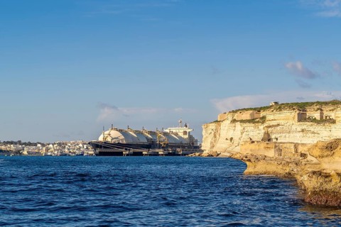 Floating Storage Unit or FSU next to power station by Marsaxlokk, south of Malta