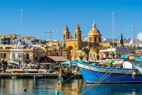 Beautiful view of Marsaxlokk, traditional maltese fisherman village on south of the island, Malta