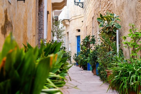 Charming medieval full of flowers street of Rabat Mdina in Malta