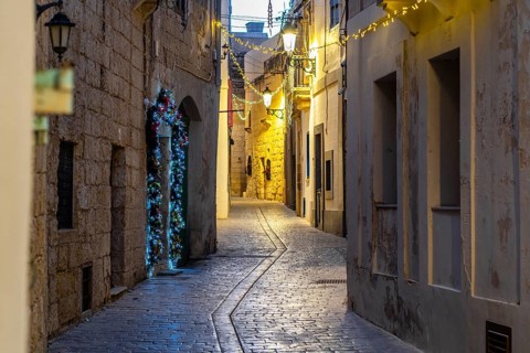 Charming illuminated medieval streets of Rabat Mdina in the evening Malta
