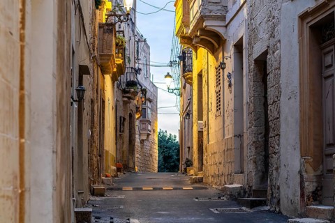 Charming illuminated medieval streets of Rabat Mdina in the evening Malta