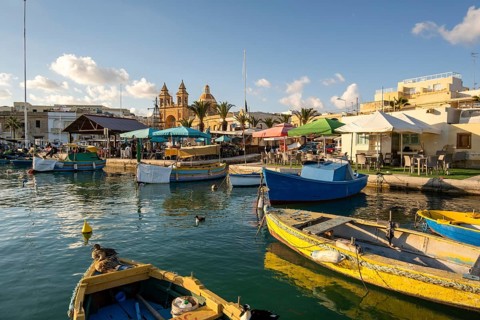 Beautiful view of Marsaxlokk, traditional maltese fisherman village on south of the island, Malta