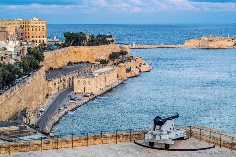Seafront view of historic La Valletta with Lower Barrakka gardens, taken from Upper Barrakka