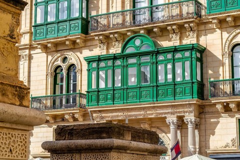 Beautiful close up of wooden green historic windows in Valletta, Malta