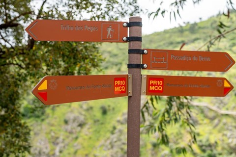 Brown information sign indicating different trails in Monchique area, Algarve, Portugal