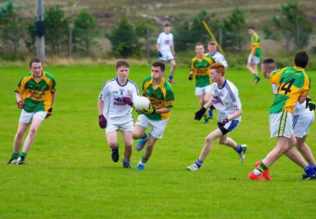 CLIFDEN, IRELAND, AUGUST 30, 2015: Young Men Playing a Match of Gaelic Soccer