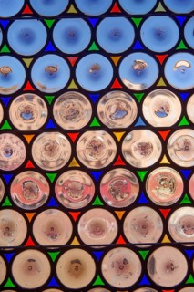Antique window with round panes in Siena