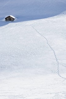 Footprints to a hut in the snow, Fiescheralp, Valais, Switzerland