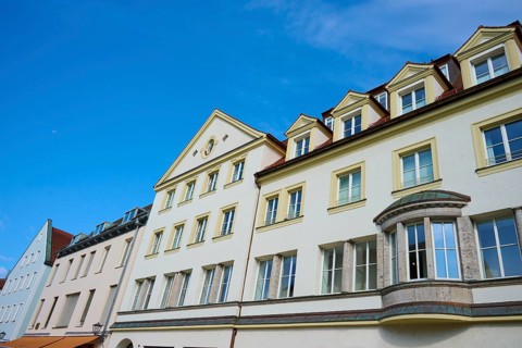 Multi-storey building under a bright blue sky with skylights, Regensburg, Bavaria, Germany