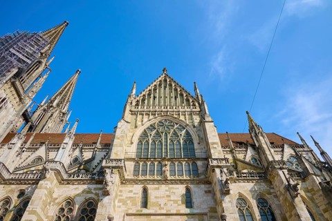 Imposing Gothic cathedral with striking towers under a clear sky, St Peter's Cathedral, Regensburg,
