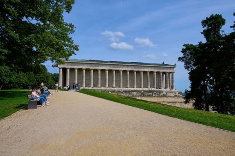 Building with columns in a green setting with walkers and trees, Walhalla, Donaustauf, Regensburg,