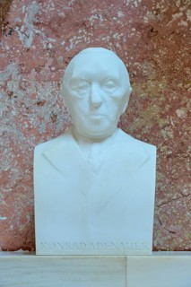 Serious marble bust of Konrad Adenauer, white marble against a red background, Walhalla,