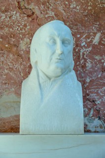 Reflective marble bust of Jean Paul, classical style against a red background, Walhalla,