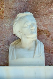 Artistic marble bust of Richard Wagner with an expressive face against a red background, Walhalla,