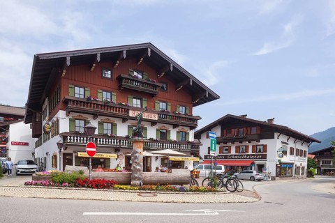 Town hall with lumberjack sculpture and catering, Reit im Winkl, Chiemgau, Upper Bavaria, Bavaria,