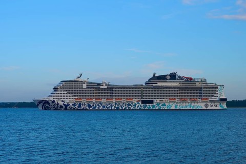 Cruise ship, MSC Euribia, sailing through the vastness of the ocean under a blue sky, Heikendorf,