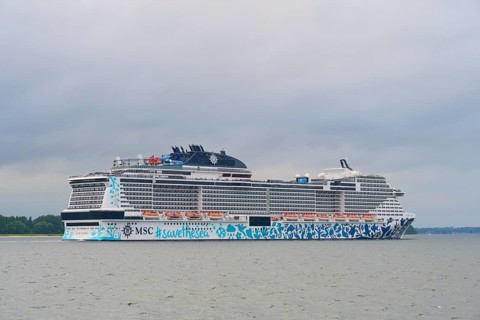 Large cruise ship, MSC Euribia, in calm waters under a cloudy sky, Heikendorf, Plön district, Kiel